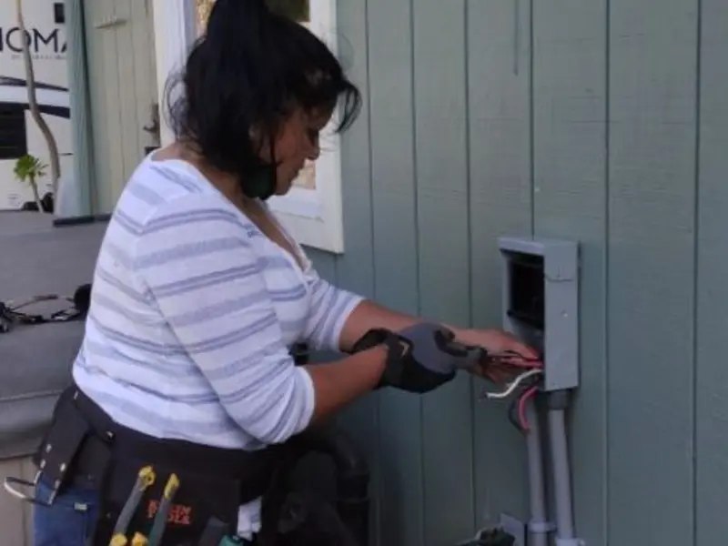 Licensed electrician wiring an exterior subpanel in Paloma Creek South